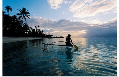 French Polynesia, Moorea, Woman Paddling In Outrigger Canoe Along Shoreline