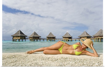 French Polynesia, Tuamotu Islands, Rangiroa Atoll, Woman Lounging On Beach