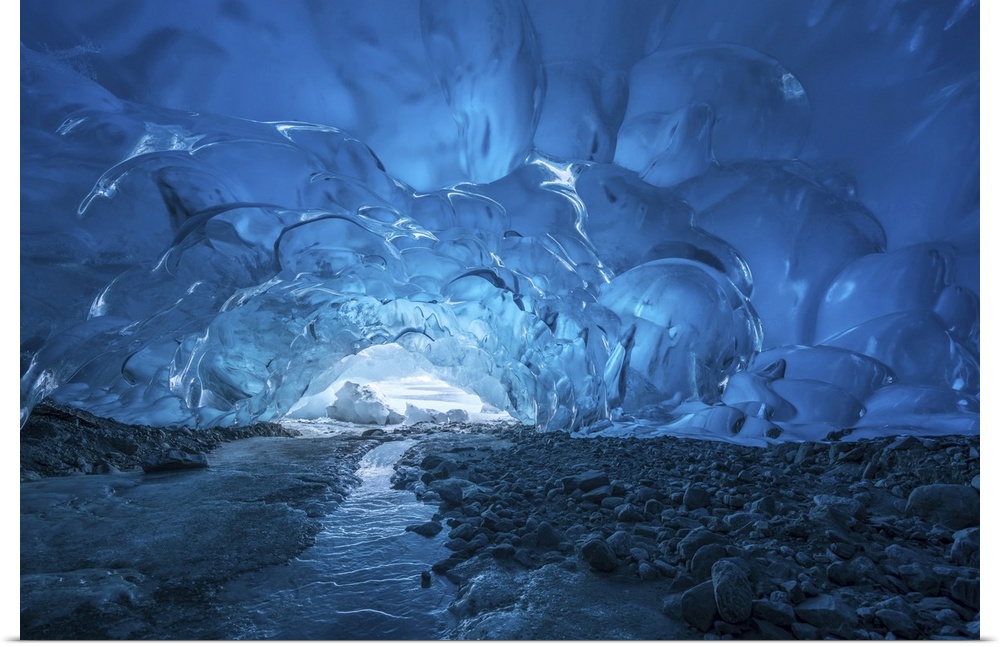 Blue glacial ice is exposed inside an ice cave at the terminus of Mendenhall glacier, Mendenhall Lake, Tongass national fo...