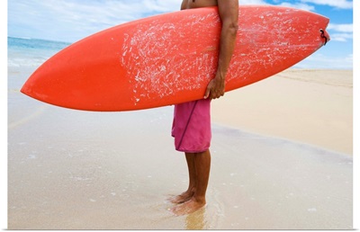 Hawaii, Kauai, Man Holding Surfboard On Beach, View From Side