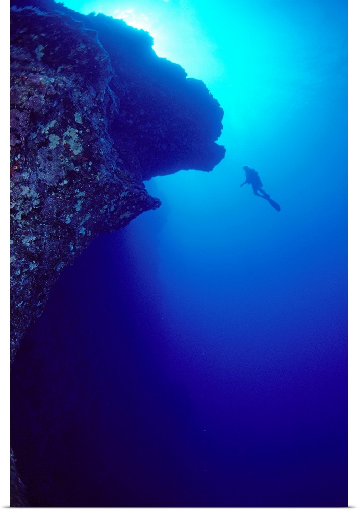Hawaii, Maui, Molokini, Diver In Distance Alongside Black Wall