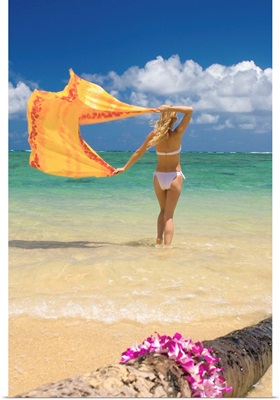 Hawaii, Oahu, Punaluu Beach, Young Woman Standing In Ocean Holding Pareo