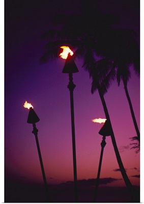 Hawaii, Tiki Torches Lit At Twilight, Purple Skies, Palm Trees