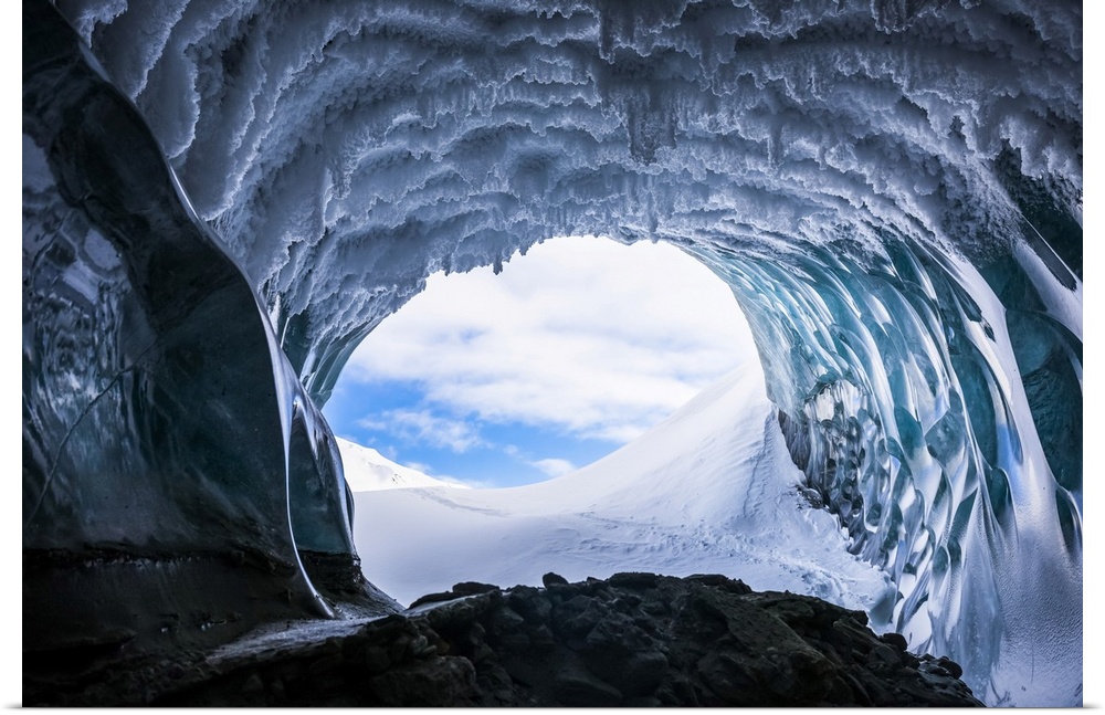 Hoarfrost hangs from the ceiling of a Canwell Glacier ice cave in winter; Alaska, USA