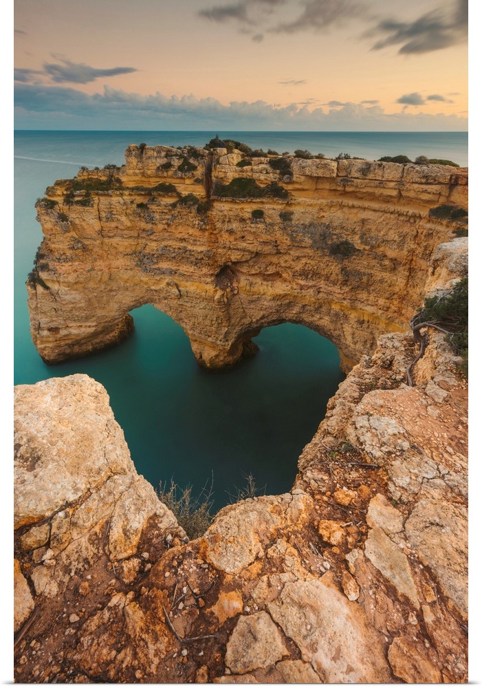 Iconic rock formation, Arcos Naturais, Heart of the Algarve, and the turquoise water of the Atlantic Ocean at Praia da Mar...