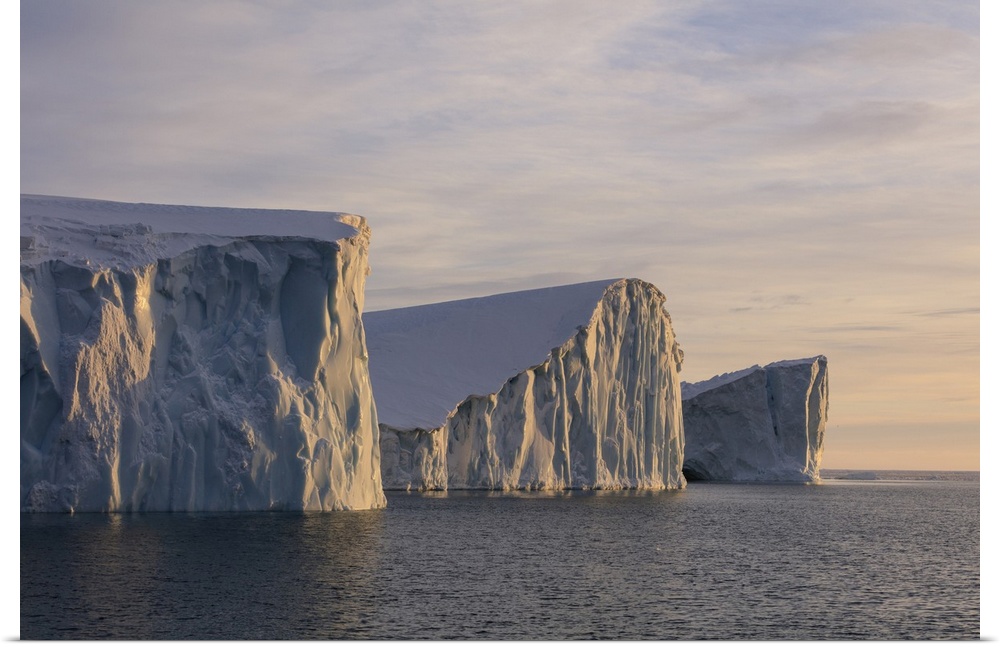 Late afternoon sunlight on icebergs in Disko Bay.