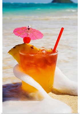 Mai Tai Getting Splashed By A Wave As It Rest On The Beach