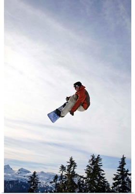 Man Snowboarding, Jumping In Mid-Air, Vancouver Island Ranges, BC, Canada