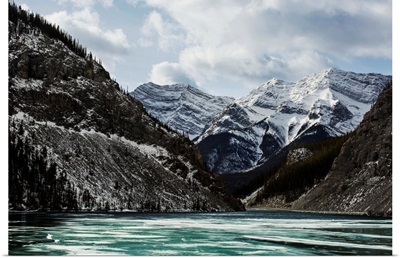 Mountains and frozen lake in winter, Bow Valley Wildland, Alberta, Canada