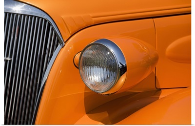 Orange Painted Vintage Car's Headlight And Front Grill; Port Colborne, Ontario, Canada