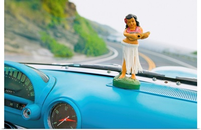 Plastic Hula Doll On The Dashboard Of A Turquoise Thunderbird