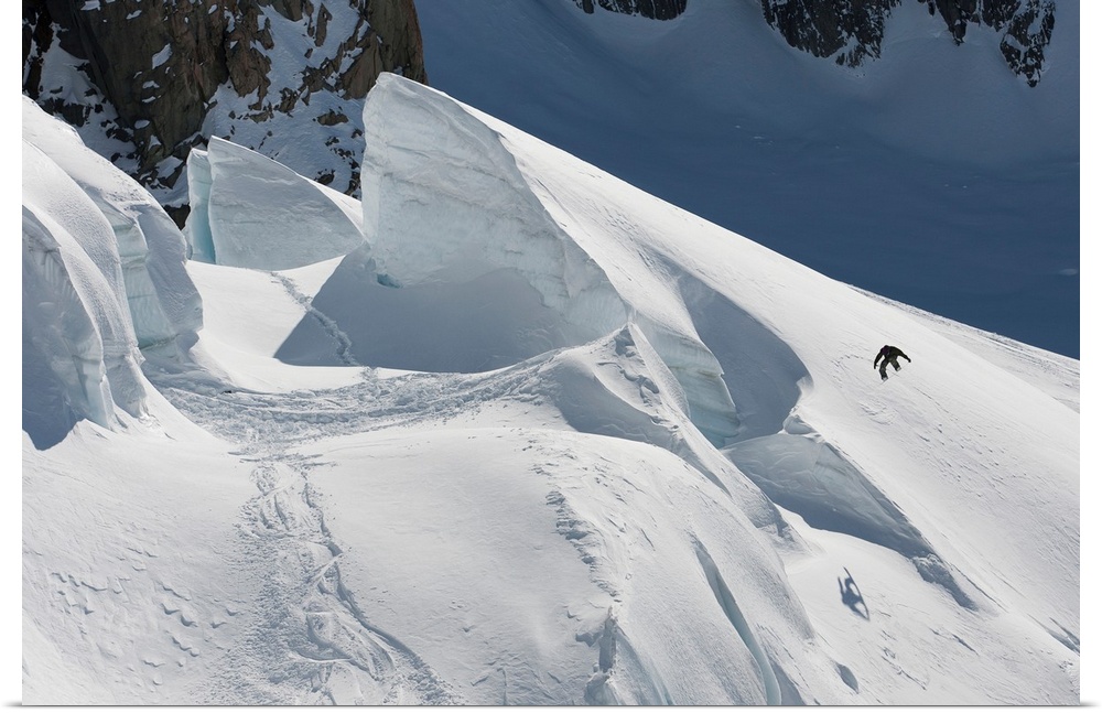 Professional snowboarder, Gigi Ruf, jumps off a glacier, New Zealand.