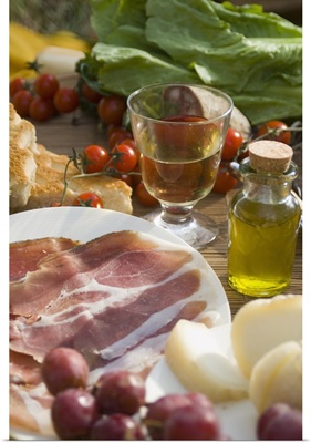 Prosciutto Ham, Cheese, Tomatoes, White Wine And Other Ingredients For A Picnic
