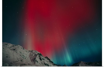 Red aurora over Talkeetna Mountains at Hatcher Pass in Southcentral, Alaska