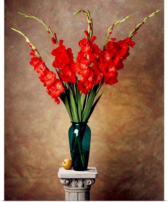 Red gladiolas in a vase on a pedestal