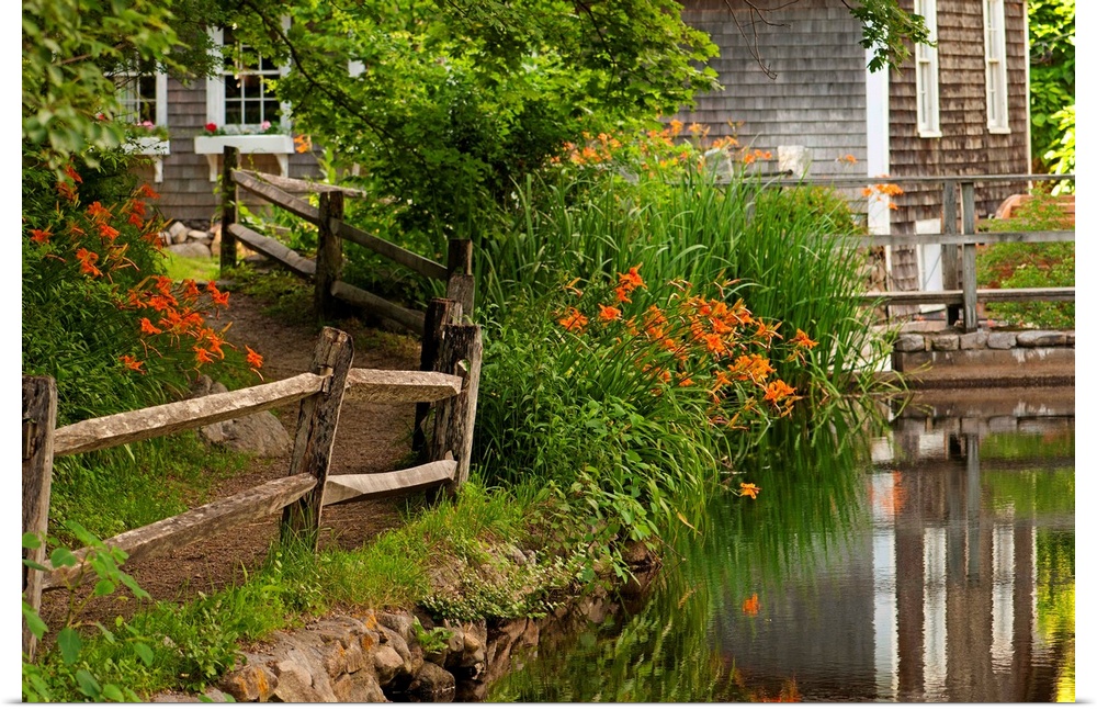 Reflections in stream and flowers in bloom at Stony Brook Grist Mill.