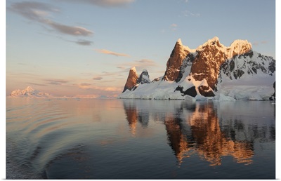 Reflections Of Cliffs And Mountains In The Lemaire Channel At Sunset, Antarctica