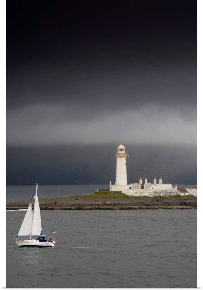 Sailboat Near A Shore With A Lighthouse; Eilean Musdile In The Firth Of Lorn, Scotland