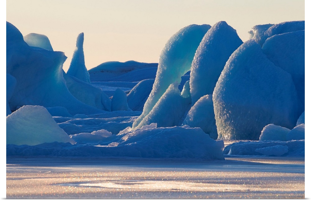 Photograph of huge ice structures.  Some are thin and tall while others are wide and round.