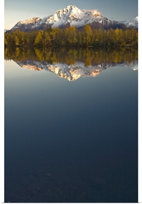 Scenic view of Pioneer Peak reflecting in Echo Lake at sunset Southcentral Alaska