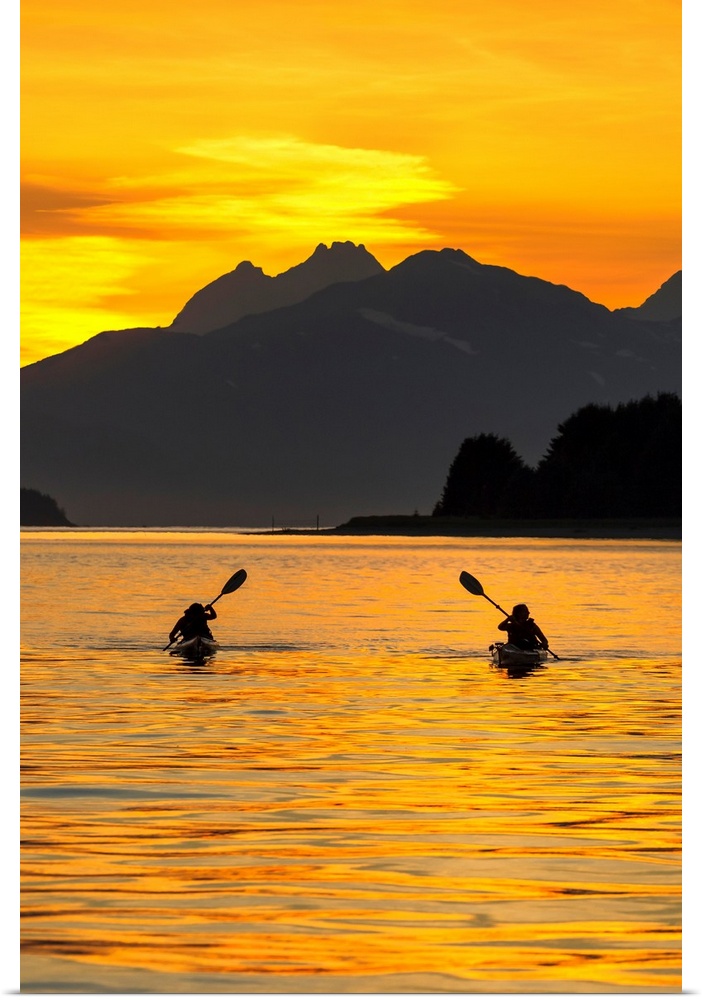 Sea Kayaking on a sublime evening in Lynn Canal near Eagle Beach State Recreation Area, Juneau, Alaska. Chilkat Mountains ...