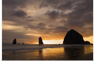 Silhouette Of Rock Formations At Sunset; Cannon Beach, Oregon, USA