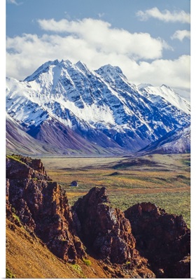 Snow Covered Denali With Rocky Cliffs And Colorful Foliage On The Tundra, Alaska