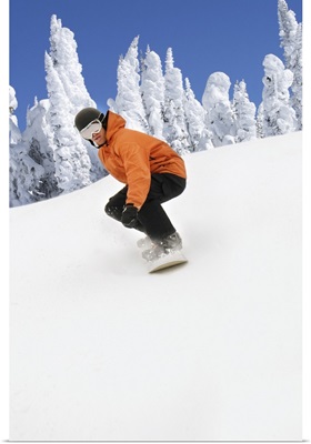 Snowboarder Going Down Snowy Hill