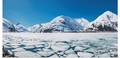 Spring ice breaking apart on the surface of Portage Lake, Chugach mountains, Alaska