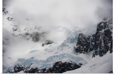 Storm Clouds Over Glacier At Lemaire Channel Along The Antarctic Peninsula
