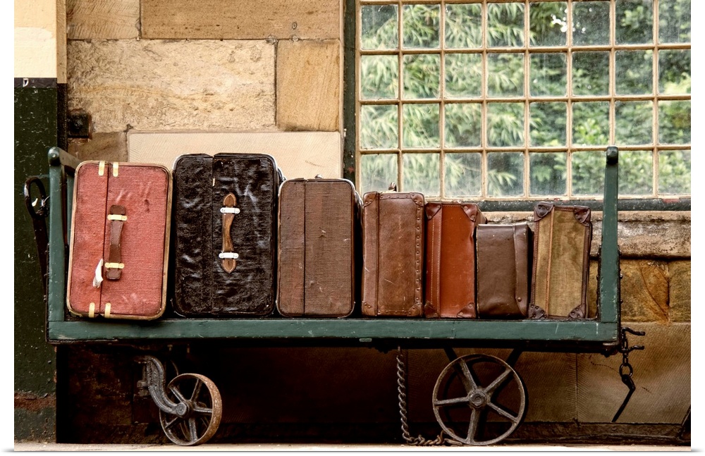 Suitcases On A Luggage Trolley In A Train Station.