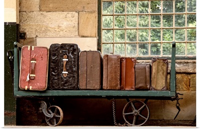 Suitcases On A Luggage Trolley In A Train Station