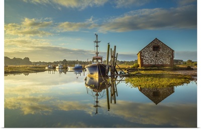 Sunrise And A Mirror Calm High Tide Coincide At Thornham Creek In North Norfolk