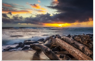 Sunrise Over Beach And Ocean With A Storm Cloud And Rain In The Distance, Kauai, Hawaii