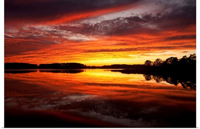 Sunset over a Chesapeake Bay shoreline.; Kent Island, Maryland.