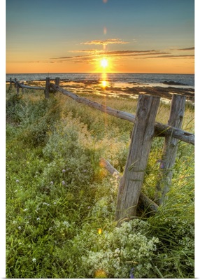 Sunset Over Water With Fence Along The Shoreline; La Martre, Quebec, Canada