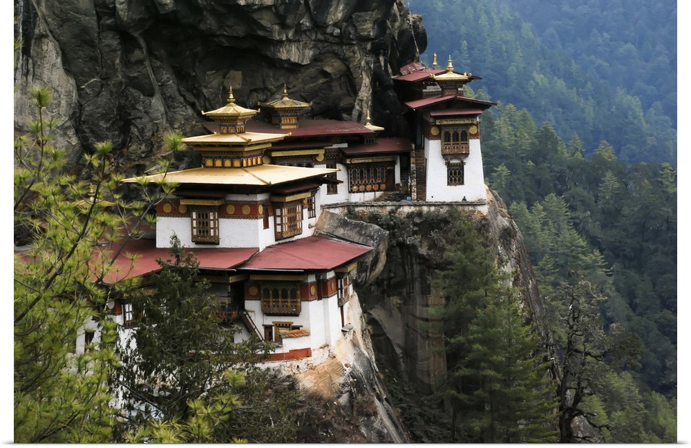 Taktsang Lhakhang, known as The Tiger's Nest, is a monastery clinging to a vertical granite cliff. Paro, Bhutan