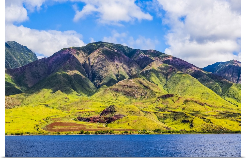 The rugged landscape of the island of Maui under a blue sky with cloud, Maui, Hawaii, United States of America