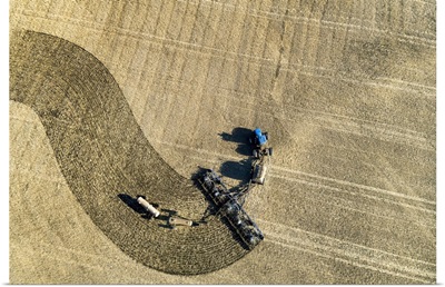 Tractor Pulling An Air Seeder, Seeding A Field, Beiseker, Alberta, Canada