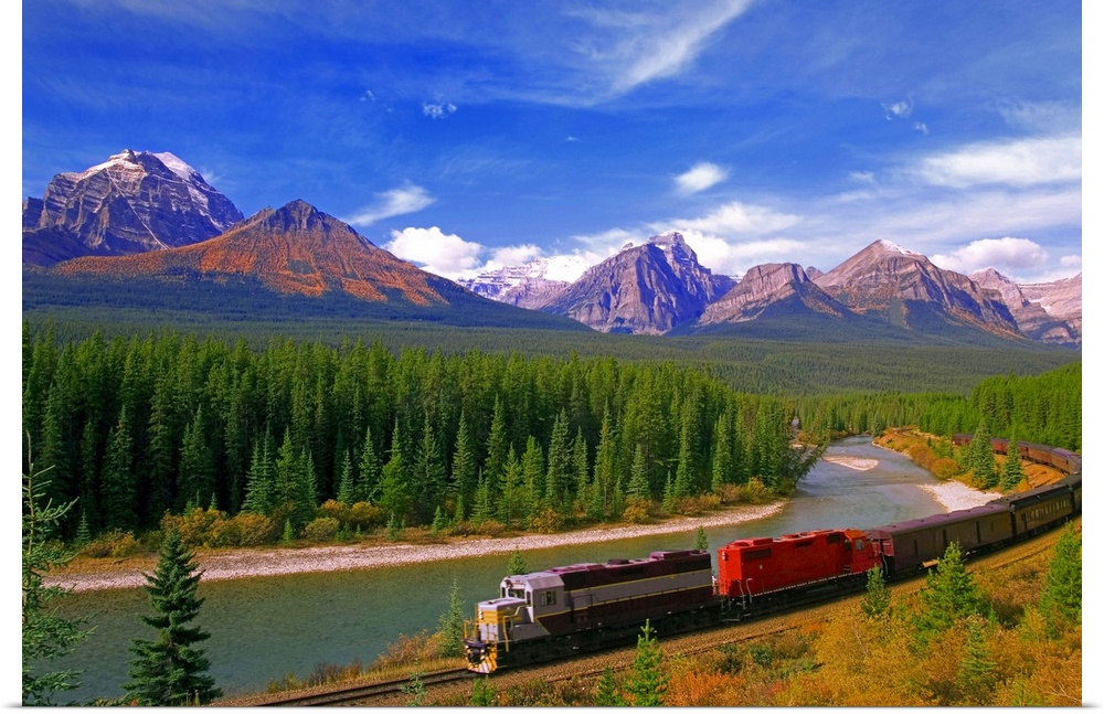 Big canvas photo art of a train running through the Canadian countryside with forests surrounding it and rugged mountains ...