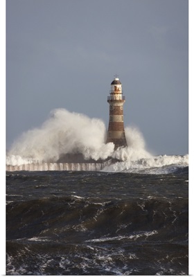 Waves Crashing Against A Lighthouse; Sunderland, Tyne And Wear, England