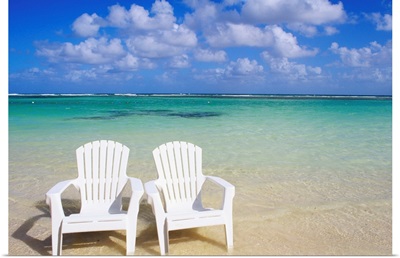 White Beach Chairs On Beautiful Beach, Clear Turquoise Water