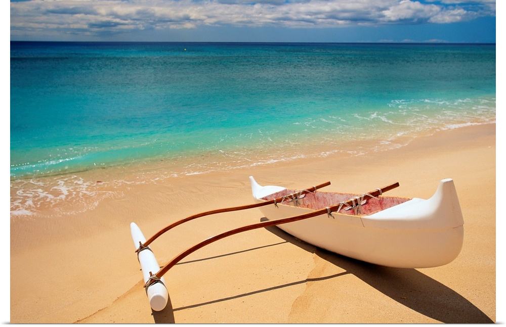 Horizontal canvas of a canoe sitting on a beach with crystal clear water washing ashore from the ocean.