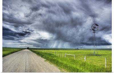 Windmill And Country Road With Storm Clouds Near Carstairs, Alberta