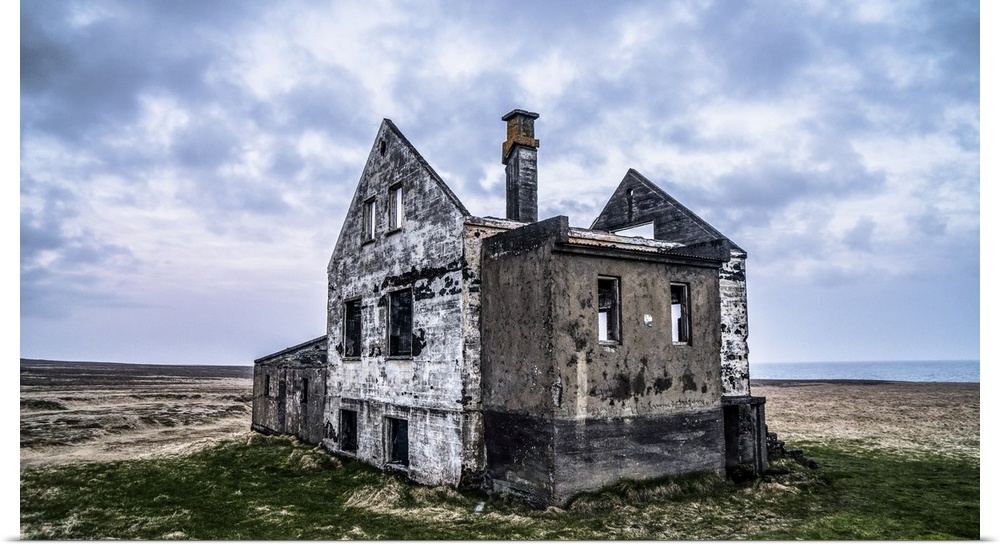 A worn out house in Iceland. Several of these houses exist, sometimes with a newer farm close by or in this case, alone; I...