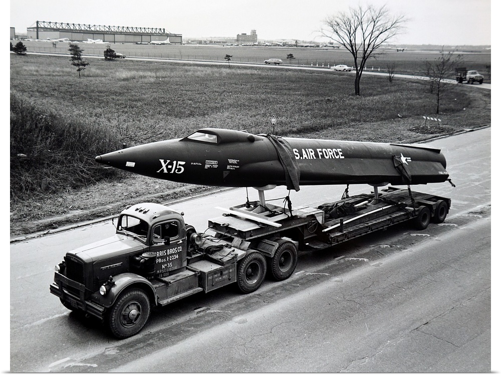 Photograph of the X15 research aircraft being trucked to Cleveland Public Auditorium for complete assembly and display dur...