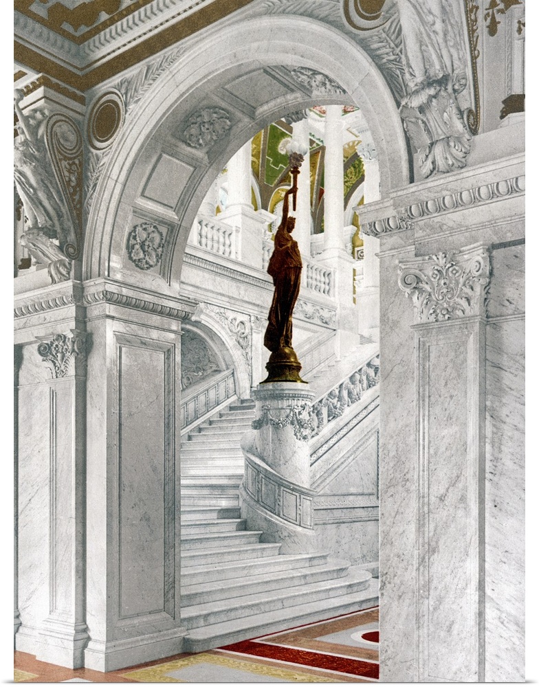 Big, vertical vintage photograph of  the elaborate North staircase in the Library of Congress, a statue on a pillar at the...