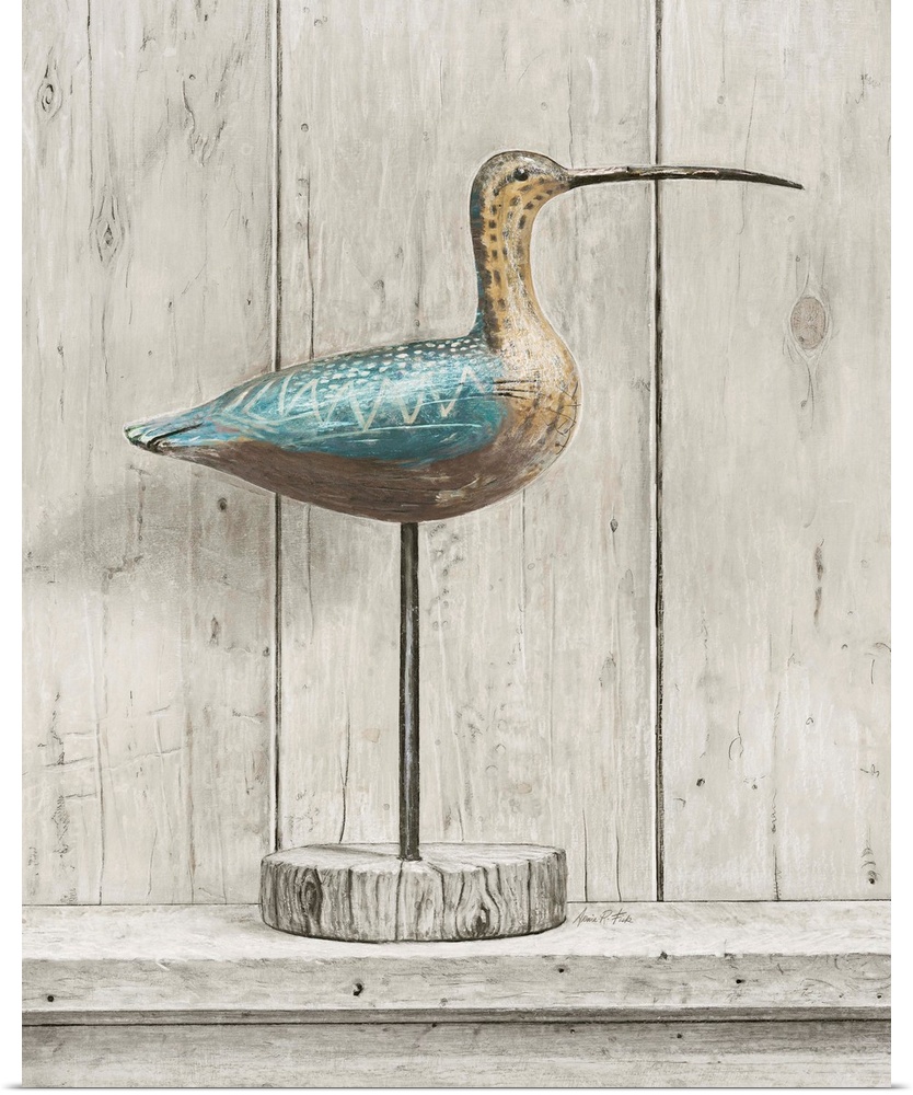 Contemporary coastal themed artwork of a wooden bird statue against a washed wood background.
