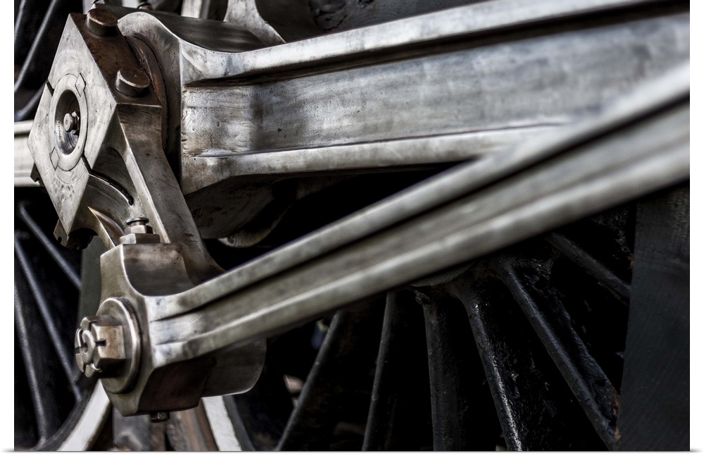 A close-up photograph of the wheels of a train.