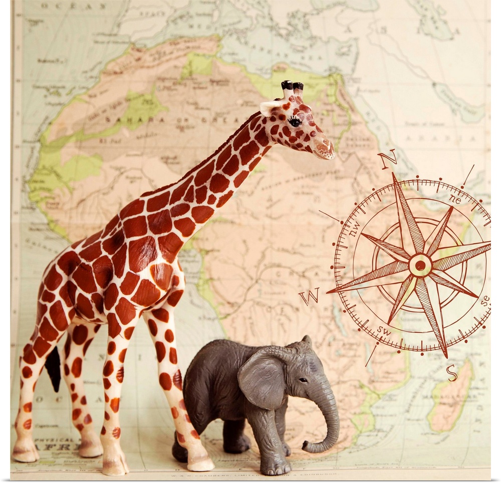 A toy elephant and giraffe with a vintage map backdrop.